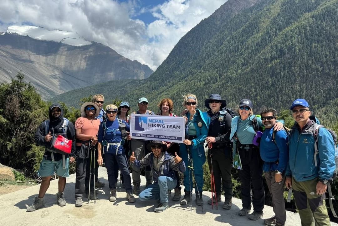 Annapurna Circuit Trek Group With Banner