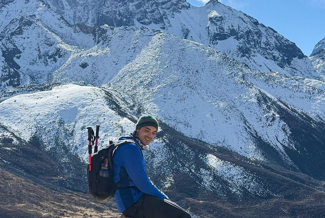 Resting During Trekking With Background Beautiful View