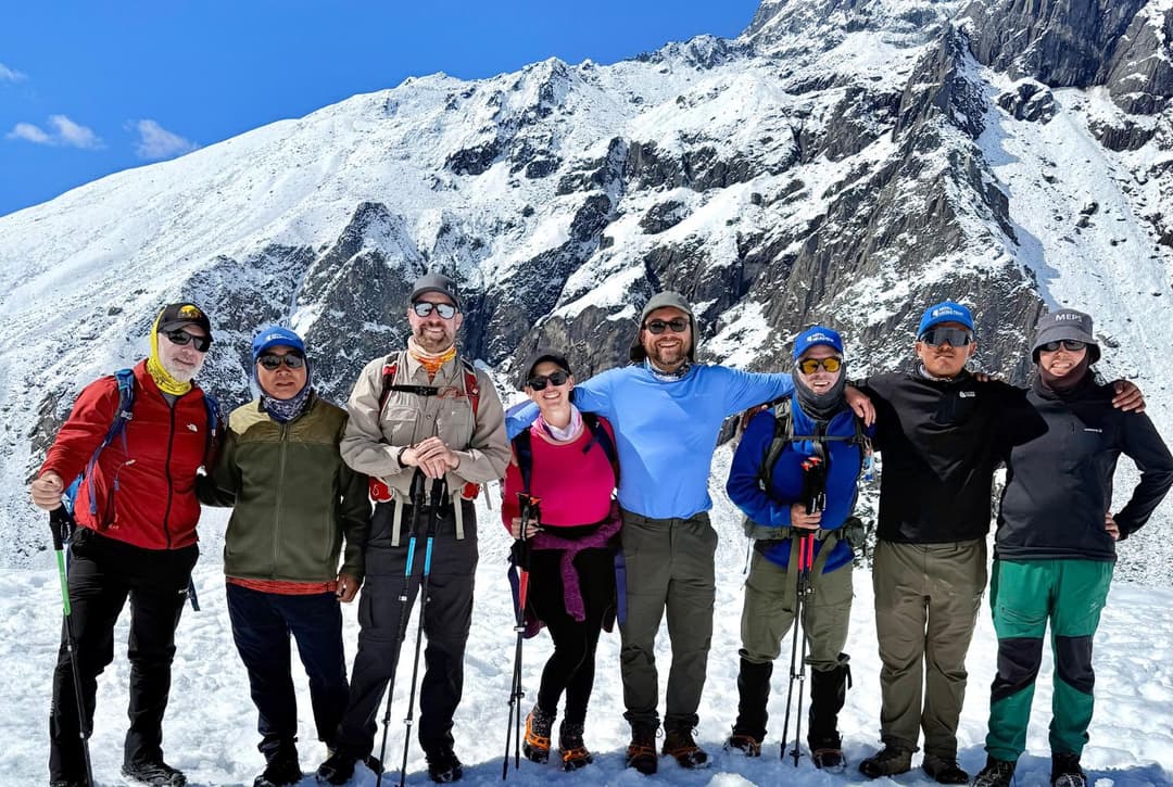 Group of trekkers at Nangkartshang Hill viewpoint above Dingboche on the Everest Base Camp trek acclimatization day.