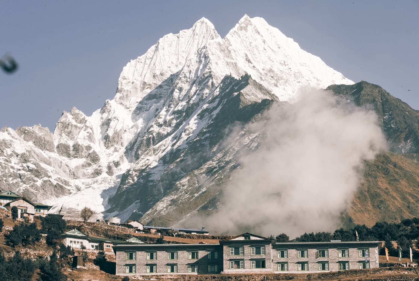 Stone Mountain Lodge In Namche Bazaar With Mount Thamserku (6,623 M) Towering In The Background
