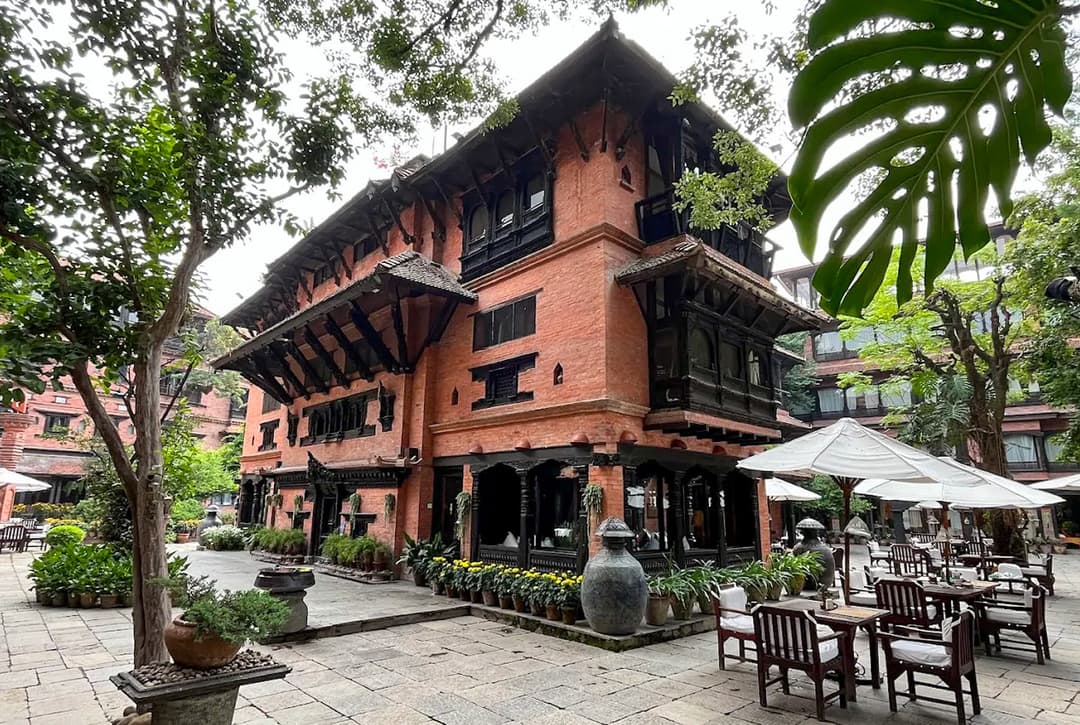 Traditional Newari Architecture Of Dwarika's Hotel In Kathmandu With Carved Wood And Brick Walls