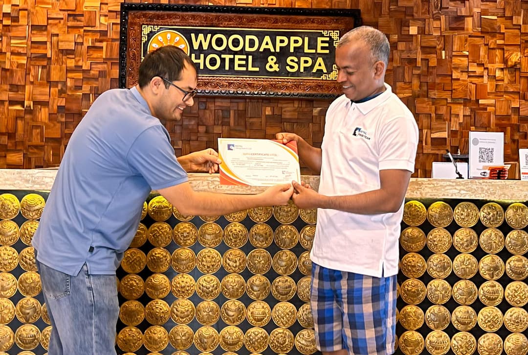 Nepal Hiking Team presenting an Everest Base Camp trek completion certificate to a trekker in Kathmandu.