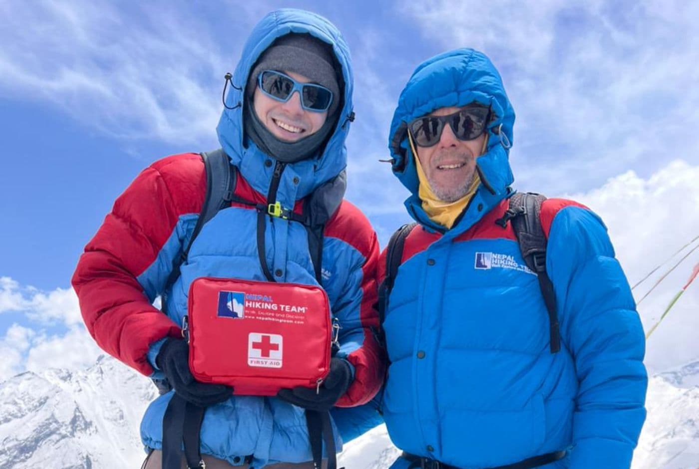 Langtang Valley Trek safety support with Nepal Hiking Team guide carrying first aid kit in high Himalayan terrain