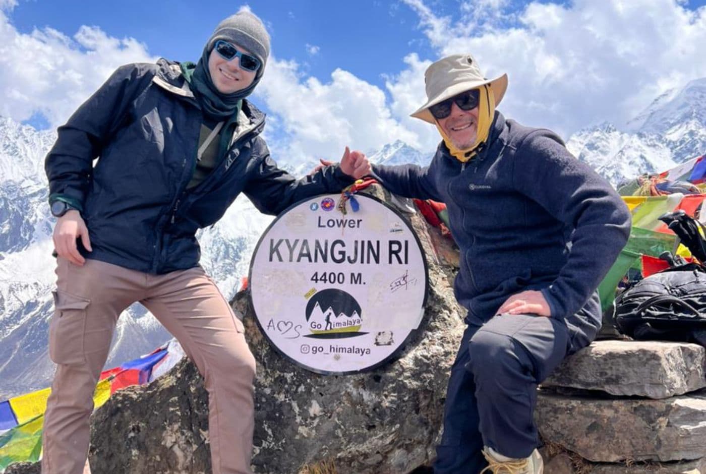 Langtang Valley Trek trekkers at Kyanjin Ri 4400 meters viewpoint overlooking Langtang Himalayas and glacier landscapes