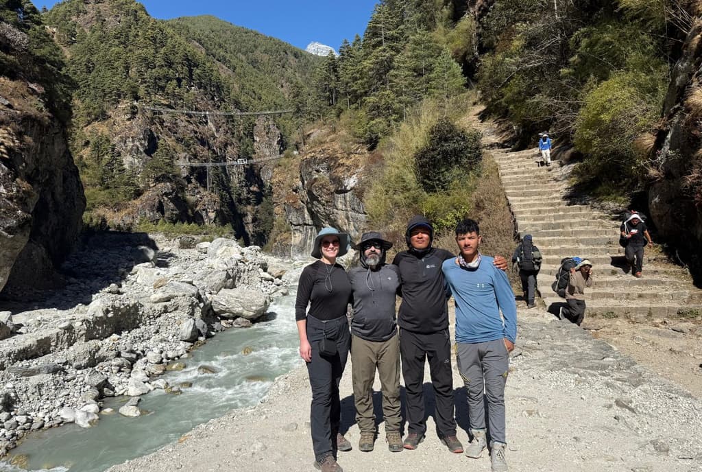 Group photo with two Hillary Bridge heading 3 hour remaining from Namche