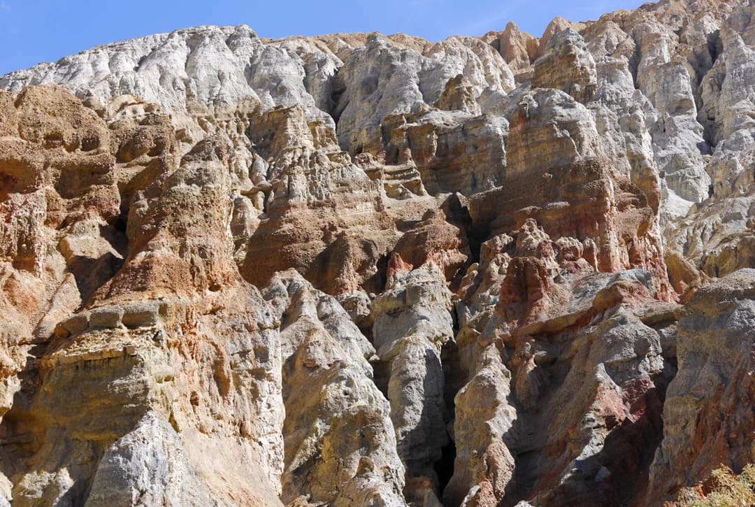 Wind Eroded Red And White Cliffs Near Chhusang Village On The Upper Mustang Trek With Drive Back