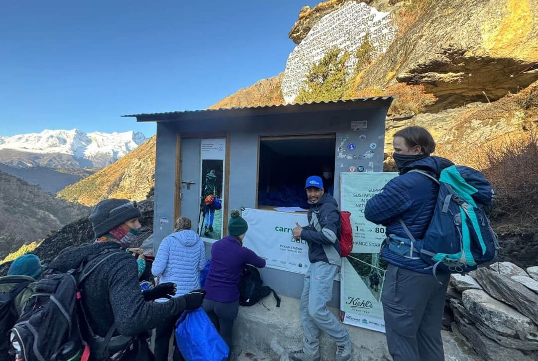 Trekkers participating in the Carry Me Back waste initiative at Pangboche on the Everest Base Camp trek.
